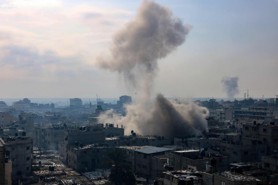 A plume of smoke rises during an Israeli strike on the Rafah refugee camp in the southern Gaza Strip. - AFP PIC