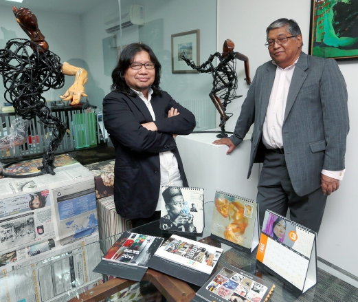 Pakhruddin (left) and Hamzah are avid collectors of local artworks. Pix by Shiraz Ali