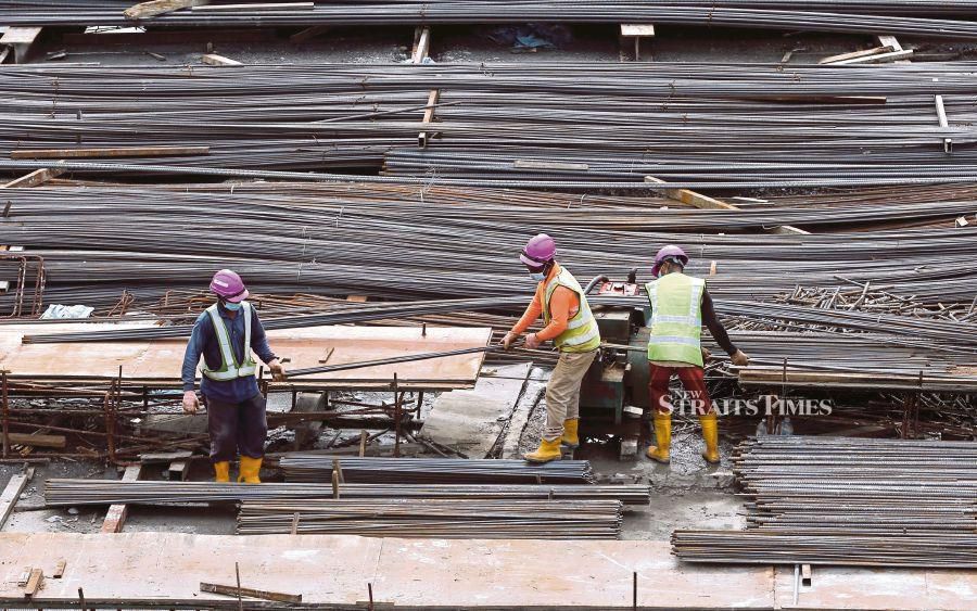 A file pic showing foreign workers working at a construction site in Kuala Lumpur. - NSTP file pic