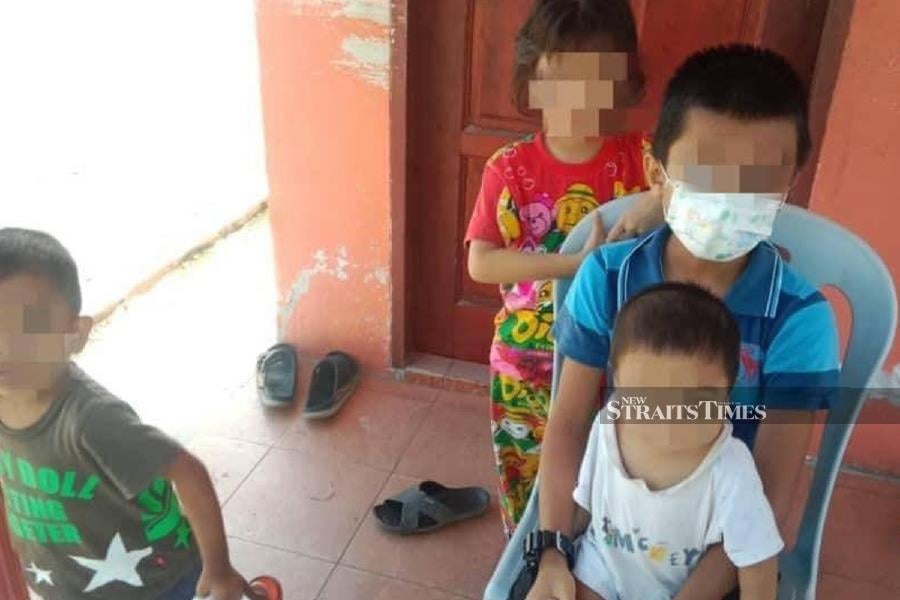 In a heart-wrenching incident, a trio of boys aged 11, three, and a 10-month-old infant, along with their six-year-old sister, were discovered abandoned in front of the Perak Tengah Administrative Complex yesterday. - Pic courtesy from reader