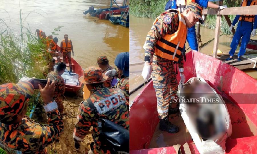 Rescuers carry the remains of the victim at the Pok Jeng jetty in Tumpat. - Pic courtesy of Fire and Rescue Dept.