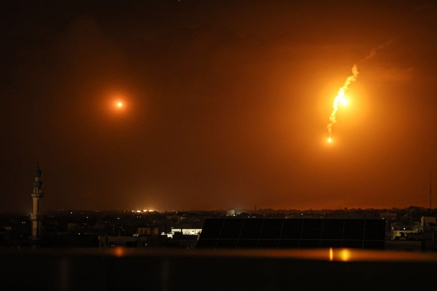 A picture taken from Rafah on January 10, 2024, shows flares fired by Israeli troops over Khan Yunis in the southern Gaza Strip. - AFP PIC