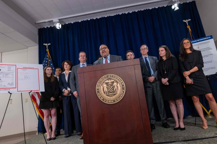  Manhattan District Attorney Alvin Bragg stands with members of his staff at a news conference following the conviction of former U.S. President Donald Trump in his hush money trial on May 30, 2024 in New York City. -AFP PIC