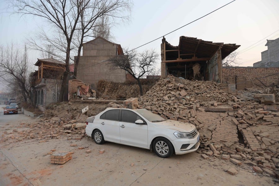 Collapsed buildings are seen after an earthquake in Dahejia, Jishishan County, in northwest China’s Gansu province. - AFP PIC