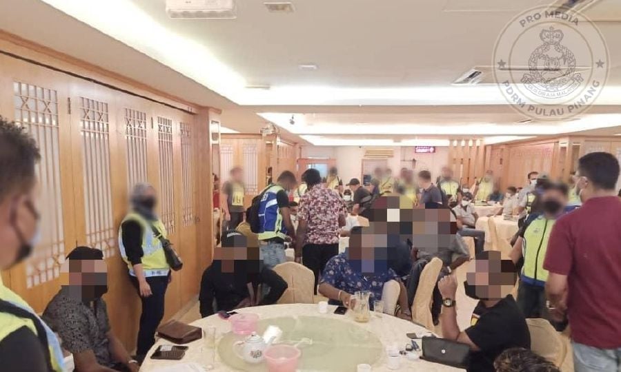 When police stormed the premises, the men, aged between 22 and 56, were having a ceremony to introduce and register new members. - Pic credit Facebook PolisPulauPinang