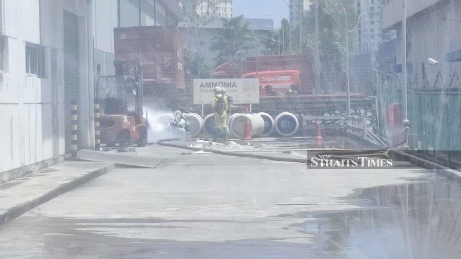 A Hazmat team on the scene following the leakage at a factory in Shah Alam. - Pic courtesy Fire and Rescue Dept. 
