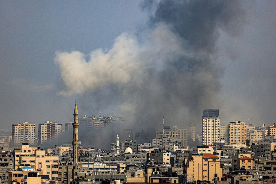 A plume of smoke rises above buildings in Gaza City during an Israeli air strike, Israeli forces battled holdout Hamas fighters and pounded targets in the Gaza Strip on October 8. - The Muslim Youth Movement of Malaysia (Abim) has called upon people worldwide to consistently support the current struggle of the Palestinian people. - AFP pic
