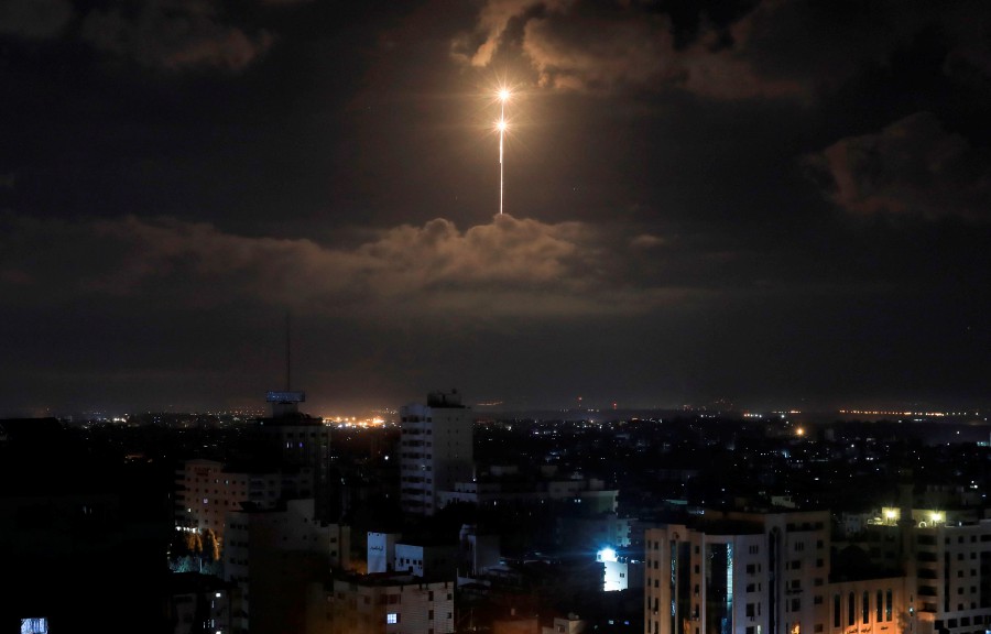The Iron Dome anti-missile system fires interception missiles seen in the sky early morning on August 21. - AFP pic