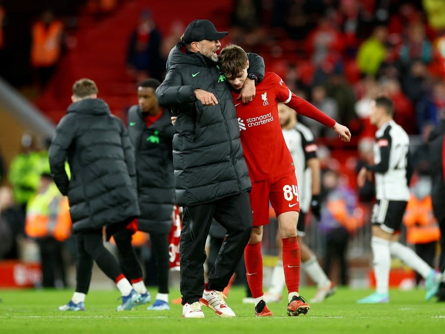 Liverpool manager Jurgen Klopp and Conor Bradley celebrate after the match against Fulham at Anfield, Liverpool. - REUTERS PIC