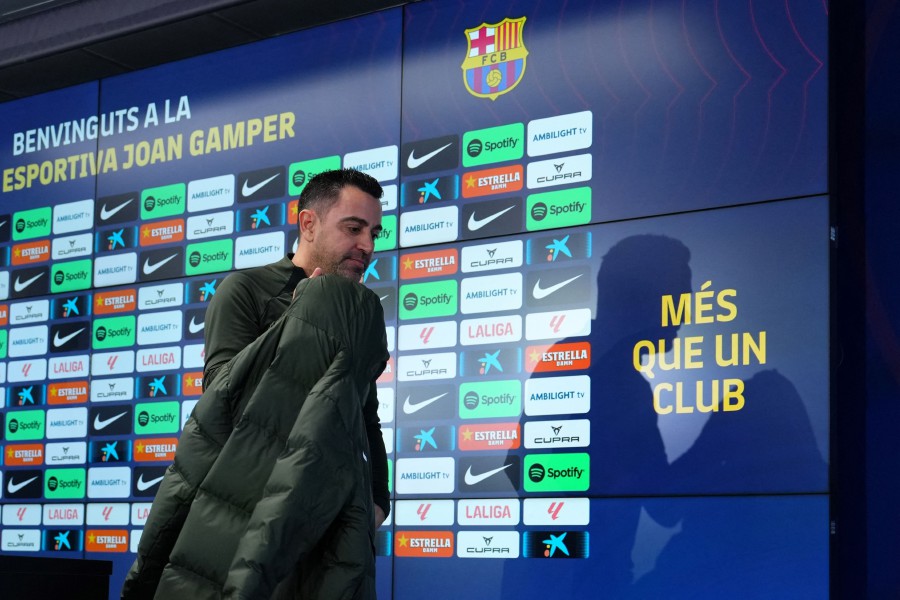 Barcelona's Spanish coach Xavi leaves after addressing a press conference at the Joan Gamper training ground in Sant Joan Despi. - AFP PIC