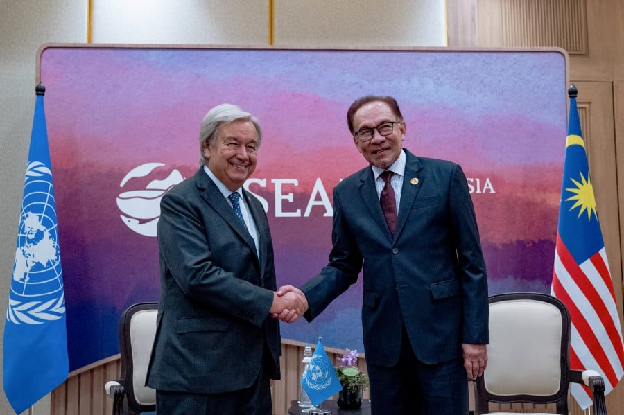 Prime Minister Datuk Seri Anwar Ibrahim (right) greets United Nations secretary-general Antonio Guterres, on the sidelines of the Asean Summit in Indonesia. - BERNAMA PIC