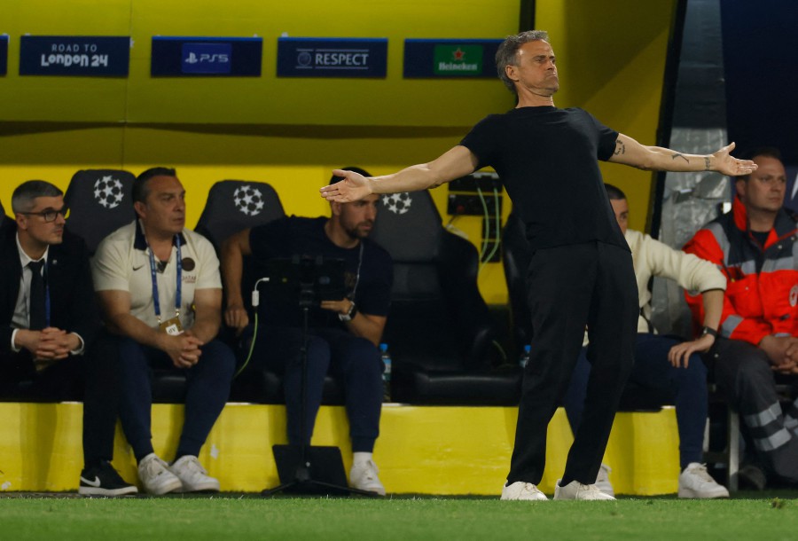 Paris Saint-Germain's Luis Enrique reacts during the UEFA Champions League semi-final first leg match against Borussia Dortmund in Dortmund. - AFP PIC