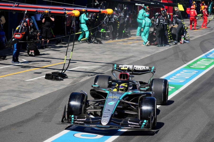Mercedes' British driver Lewis Hamilton leaves the pit lane during the Australian Formula One Grand Prix at Albert Park Circuit in Melbourne. - AFP PIC
