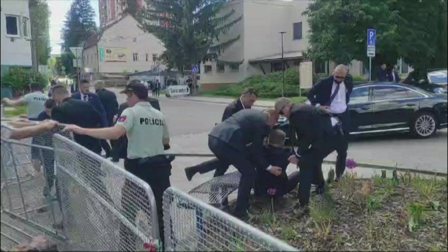 This image taken from video footage shows security personnel carrying Slovakia's Prime Minister Robert Fico (C) towards a vehicle after he was shot in Handlova on May 15, 2024. Slovakia's Prime Minister Robert Fico was battling life-threatening wounds after officials said he was shot multiple times in an assassination attempt condemned by European leaders. -- Photo by AFPTV/AFP
