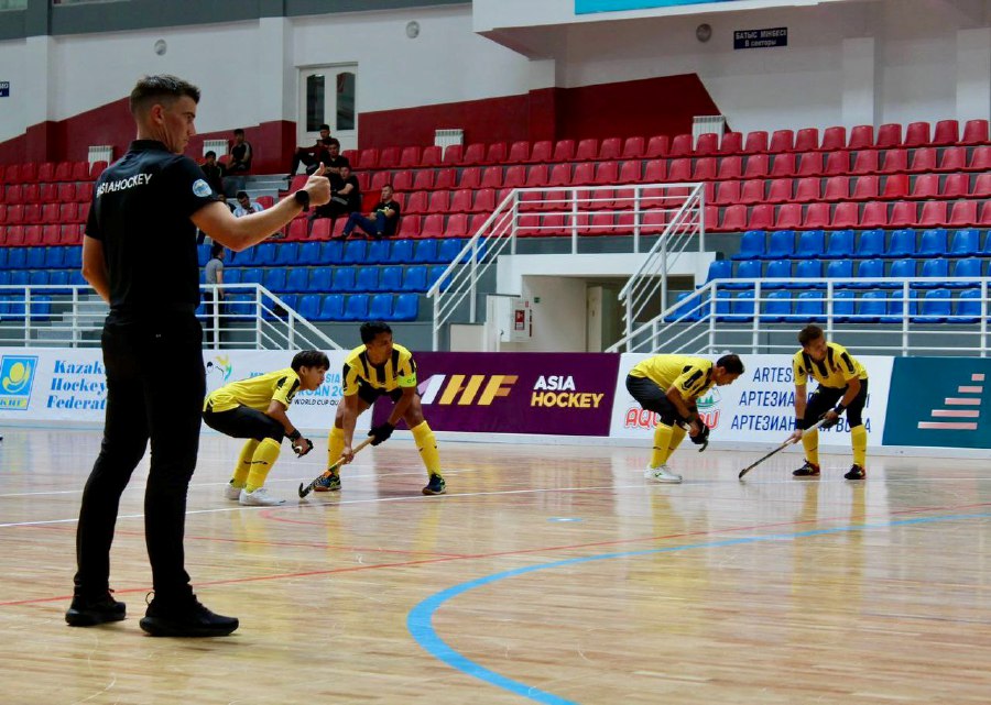 Malaysia (in yellow) in action against Oman in the men's Indoor Hockey Asia Cup in Kazakhstan.
