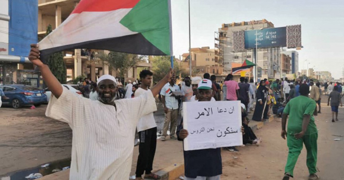 Two killed as defiant Sudanese march against coup