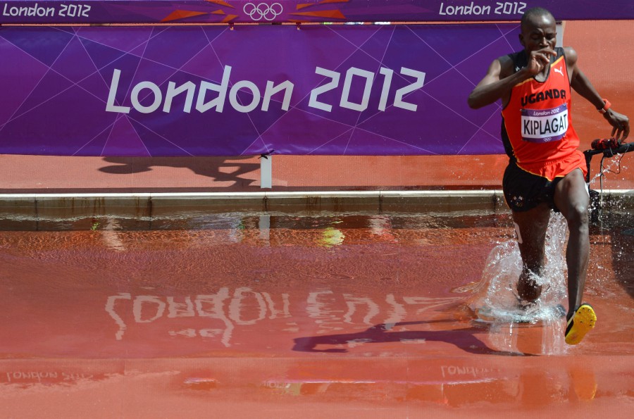 Uganda's Benjamin Kiplagat competes in the men's 3000m steeplechase heats at the athletics event during the London 2012 Olympic Games on August 3, 2012 in London. - AFP PIC