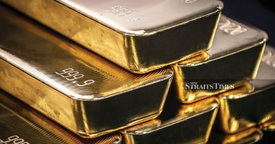 Picture shows a stack of gold bars