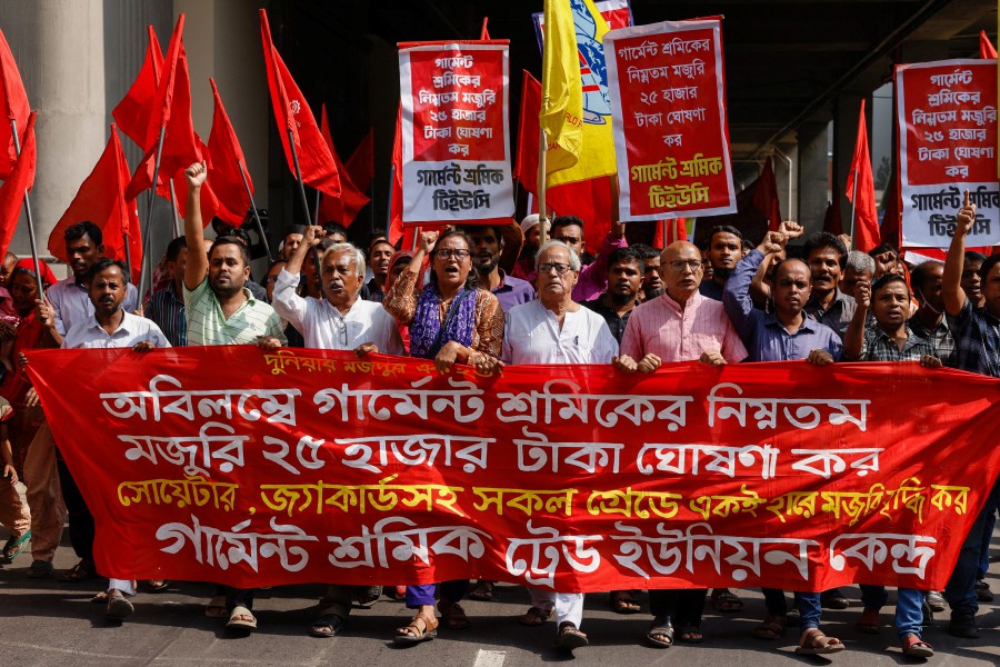 Activists from different garment workers associations join in a rally demanding further hike in minimum wages in front of the National Press Club in Dhaka, Bangladesh. - AFP PIC