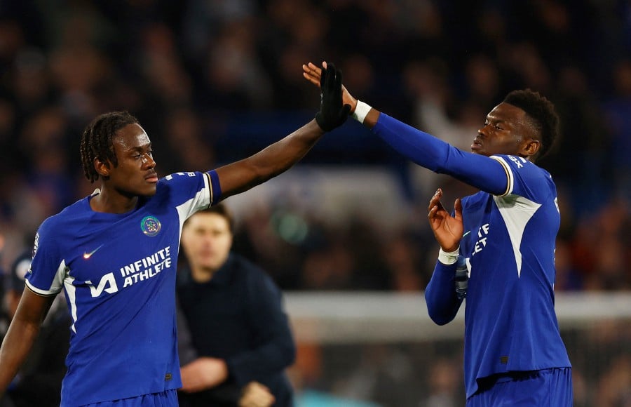 Chelsea's Trevoh Chalobah and Benoit Badiashile celebrate after the match against Spurs in London. - REUTERS PIC