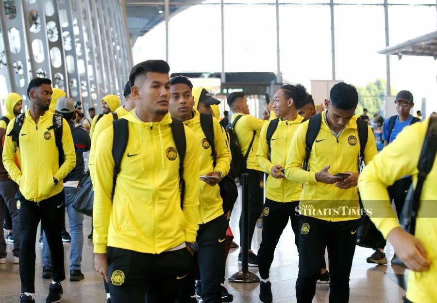 Harimau Malaya players arrive at the Kuala Lumpur International Airport before departing for Oman. - NSTP/EIZAIRI SHAMSUDIN