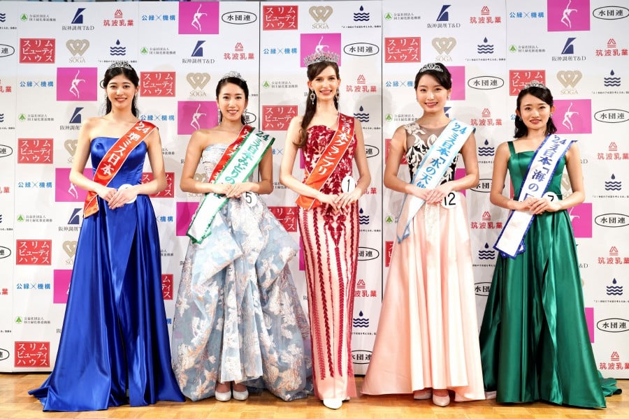 Karolina Shiino (centre), the winner of the Miss Japan 2024, poses with other prize winners at the contest in Tokyo, Japan. - REUTERS PIC