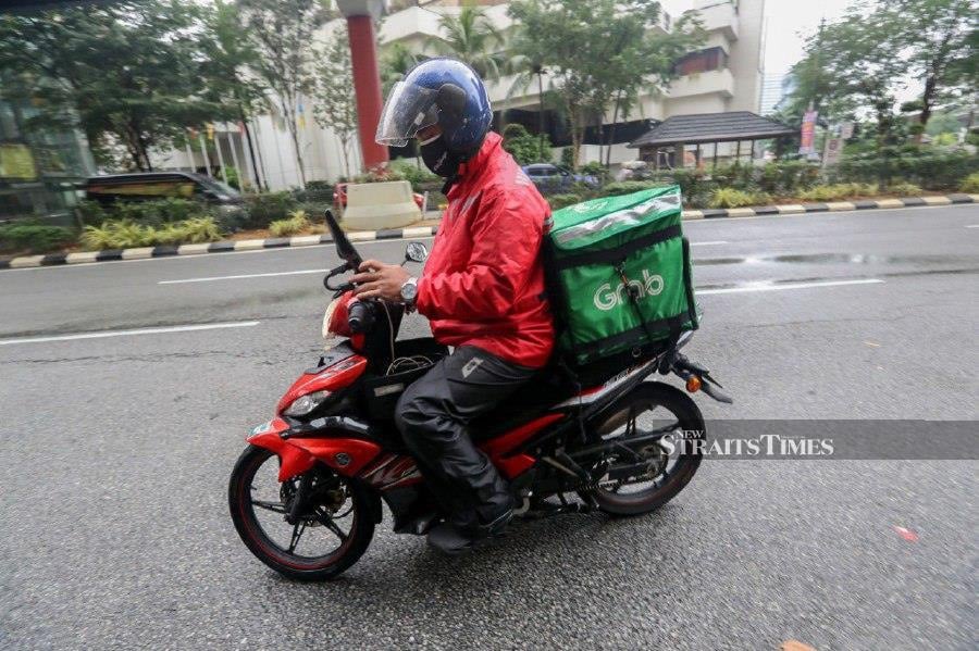Food delivery riders will go on strike for 24 hours tomorrow to protest the low delivery fares. - NSTP/OWEE AH CHUN. 