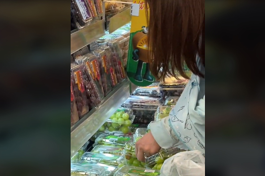A shopper was caught on video 'being picky', choosing only the best green grapes during her visit to a supermarket recently. - Screengrab from TikTok