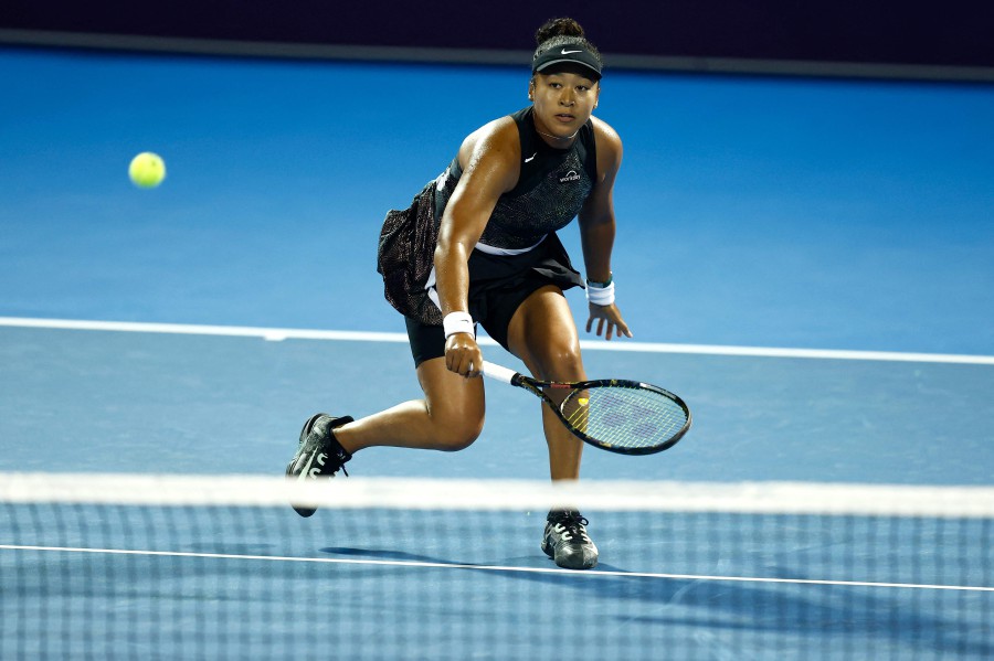 Japan's Naomi Osaka in action in the round of 32 match against Croatia's Petra Martic during their Women's Singles tennis match at the Qatar WTA Open at Khalifa International Tennis and Squash Complex in Doha. - AFP PIC