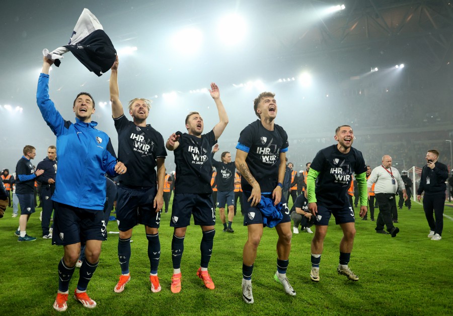 VfL Bochum's Maximilian Wittek, Lukas Daschner, Moritz Romling, Felix Passlack and Keven Schlotterbeck celebrate after winning the penalty shootout and the relegation play-off final.- REUTERS PIC