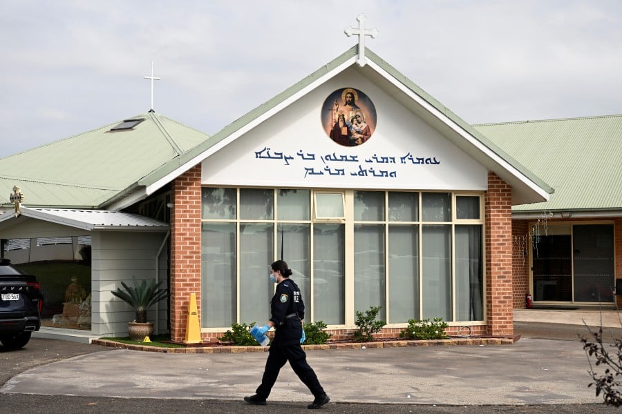 Police investigate at the Assyrian Christ The Good Shepherd Church after a knife attack took place during a service the night before, in Wakely in Sydney, Australia. - REUTERS PIC