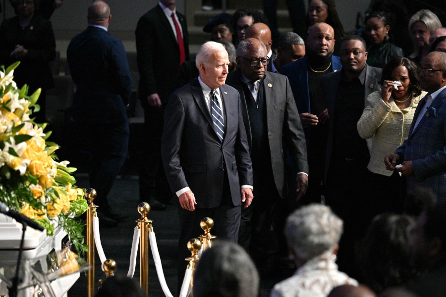 US President Joe Biden walks with US Democratic Representative from South Carolina Jim Clyburn as he arrives to pay his respects to the late Congresswoman Eddie Bernice Johnson at Concord Church in Dallas, Texas. - AFP PIC