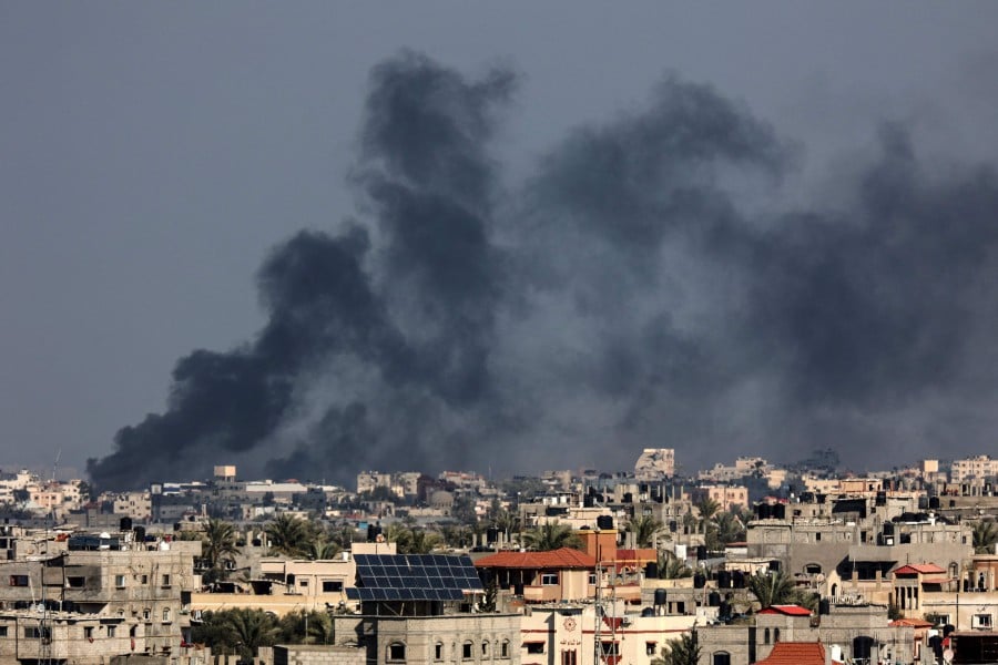 This photograph taken on January 15, 2024 from Rafah shows smoke billowing over Khan Yunis in the southern Gaza Strip. - AFP PIC