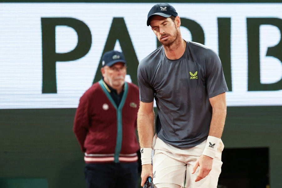 Britain's Andy Murray reacts as he plays against Switzerland's Stan Wawrinka during their men's singles match on day one of The French Open tennis tournament on Court Philippe-Chatrier at The Roland Garros Complex in Paris. - AFP PIC