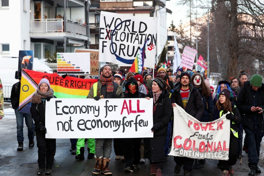 Climate activists and anti-WEF protesters attend a demonstration ahead of the opening of the World Economic Forum, in Davos, Switzerland. -REUTERS PIC