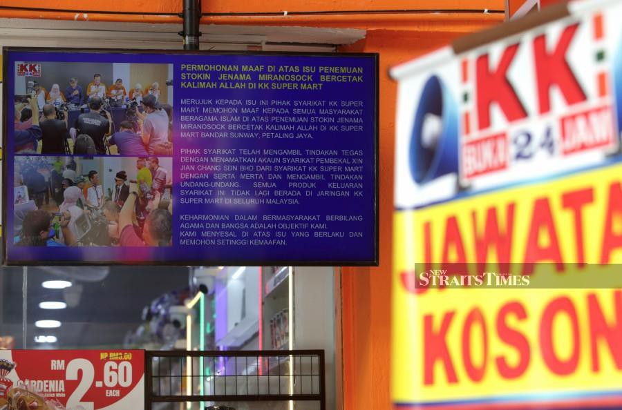A television placed outside at KK Super Mart store is seen displaying an apology notice in Kuala Lumpur on March 19. - NSTP/MOHAMAD SHAHRIL BADRI SAALI