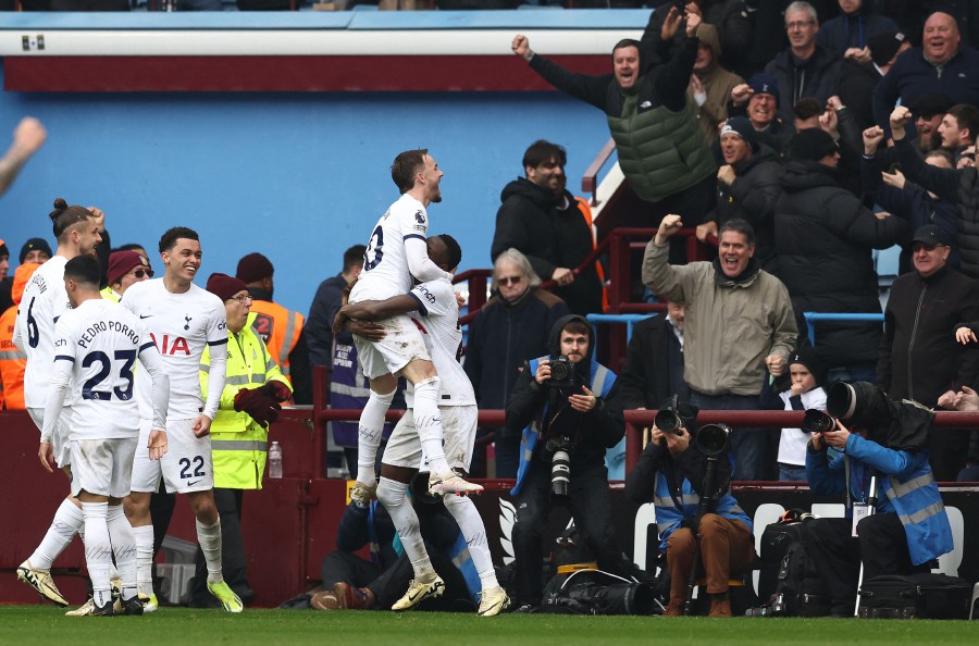 Tottenham Hotspur's James Maddison celebrates scoring the opening goal against Aston Villa at Villa Park in Birmingham. - AFP PIC