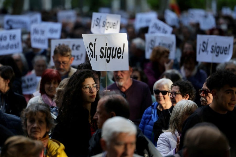 People march to show support for Spain's Prime Minister Pedro Sanchez, in Madrid, Spain. - REUTERS PIC