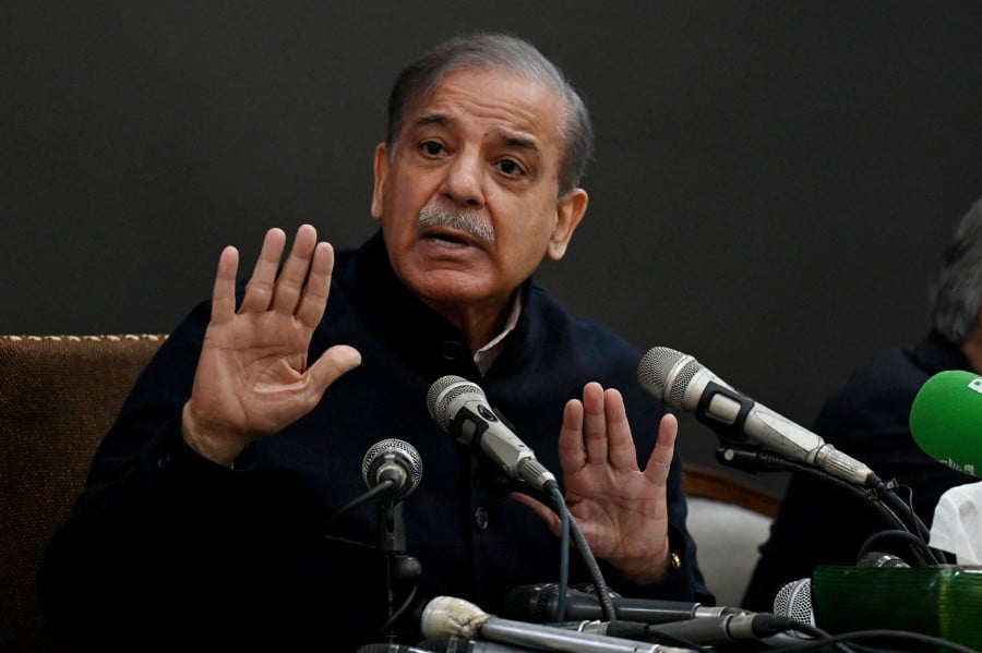 Pakistan's two dynastic parties announced late on February 20, a power-sharing agreement that is set to return Shehbaz Sharif to the premiership after an election this month failed to produce a decisive winner. -AFP PIC