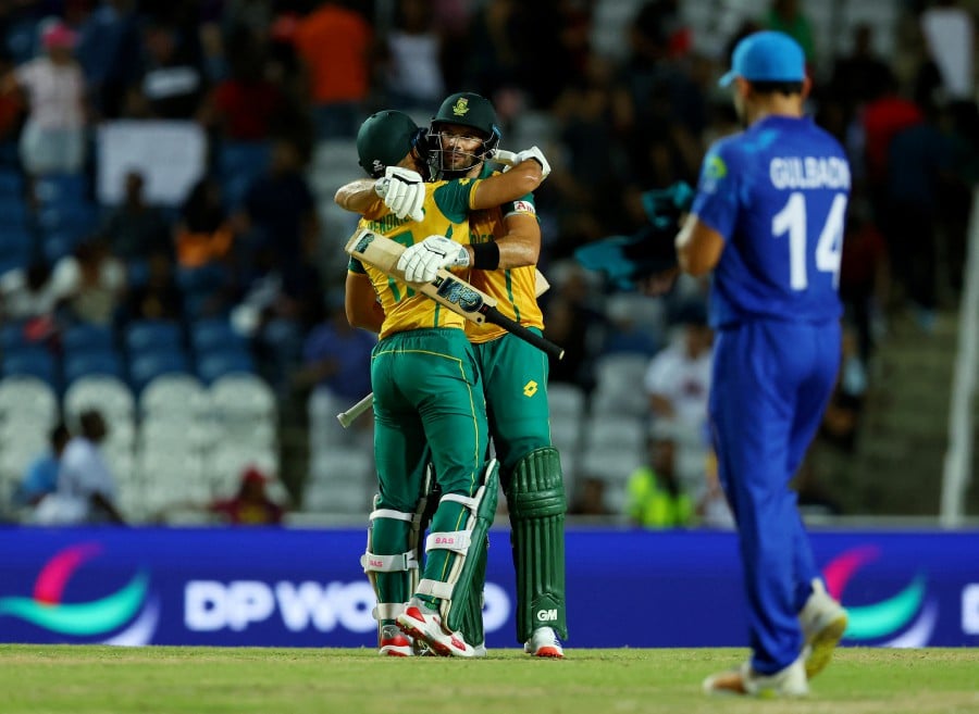 South Africa's Aiden Markram and Reeza Hendricks celebrates after winning the match against Afghanistan at the Brian Lara Stadium, Tarouba, Trinidad and Tobago. - REUTERS PIC