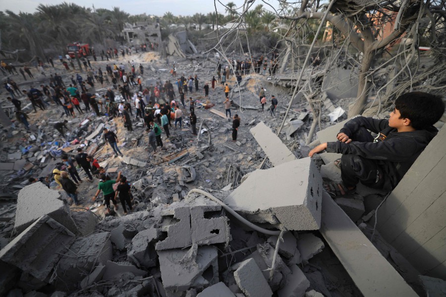 A man looks at the rubble of a house after an Israeli strike in Khan Yunis, in the southern Gaza Strip. - AFP PIC