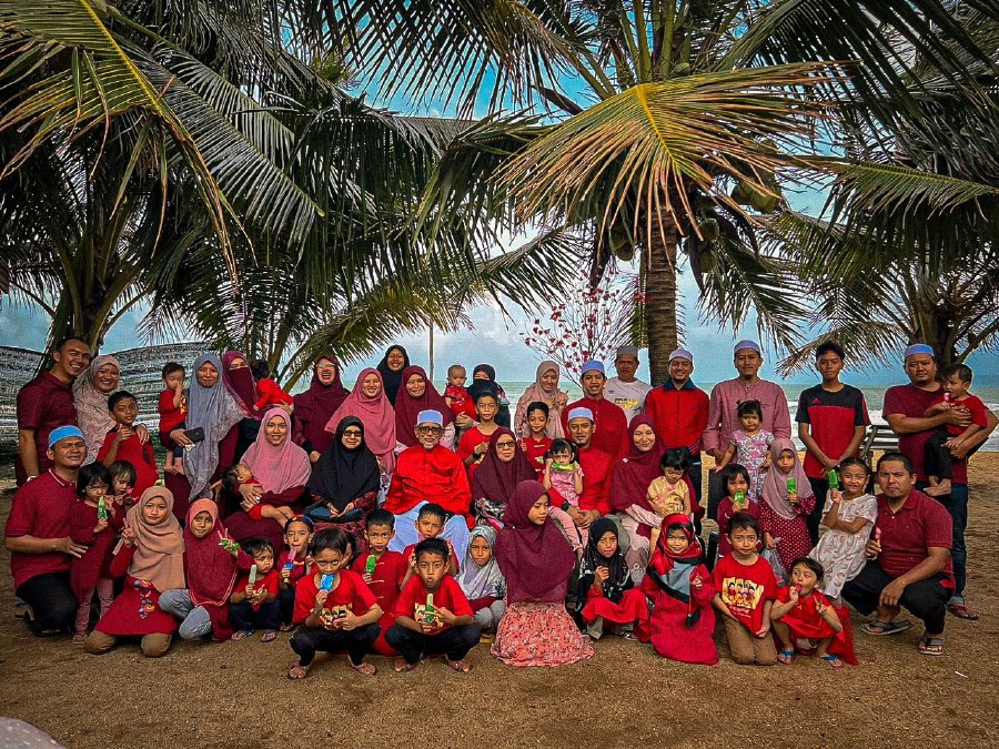 In a Facebook post yesterday, Hadi shared several photos of him and his family members clad in red, saying his grandfather had adopted children from the Chinese community whether they reverted to Islam or otherwise. - Pic credit Facebook Abdul Hadi Awang