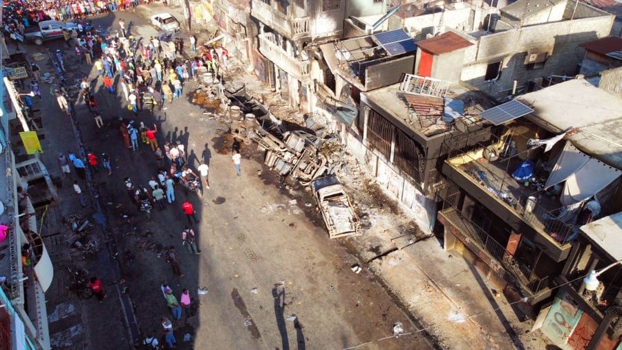 This image courtesy of the Communication Department of the Cap-Haitien City Hall shows the remains of a gas tanker truck after it exploded in Cap-Hatien, Haiti. - AFP PIC