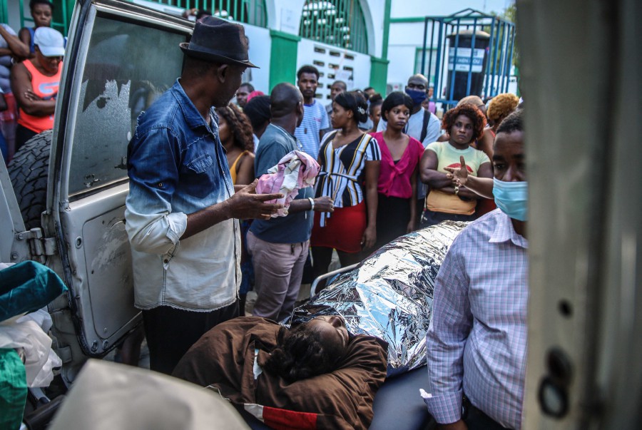 Injured people arrive at a hospital after a tanker truck exploded in Cap-Haitien, Haiti. - AFP PIC