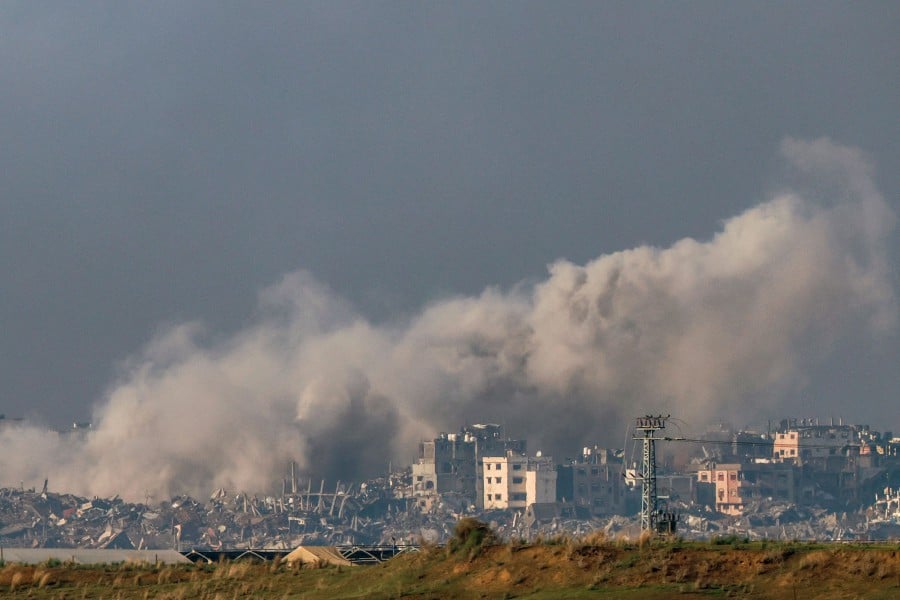 A picture taken in southern Israel near the border with the Gaza Strip shows smoke billowing during Israeli bombardment on northern Gaza. - AFP PIC