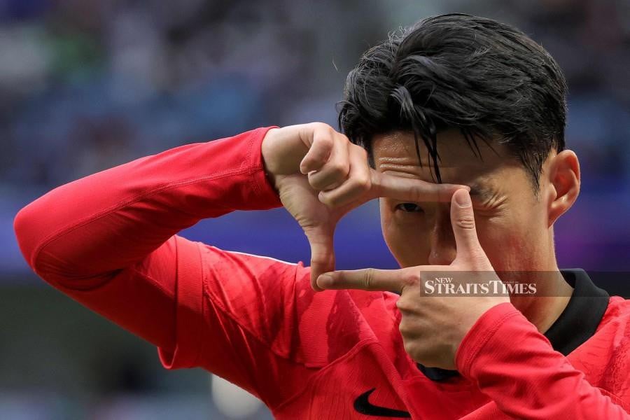 South Korea's Son Heung-min celebrates after scoring his team's third goal from the penalty spot during the Asian Cup Group E match against Malaysia at Al-Janoub Stadium in al-Wakrah, south of Doha, on January 25. AFP PIC