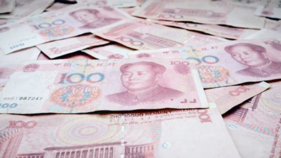 China's yuan slipped to a two-week low against the dollar as weak domestic credit data reinforced the need for more policy support while the threat of new U.S. tariffs on the world's second-biggest economy sapped confidence.