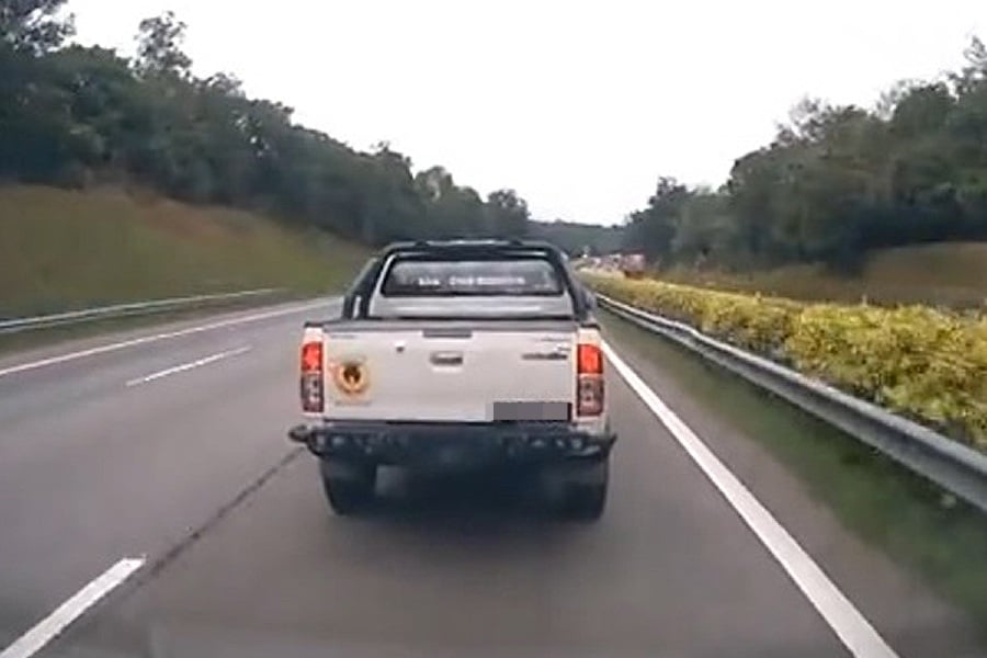 Netizens are infuriated after a video of a Toyota Hilux pickup truck blocking the path of an ambulance went viral recently. - Screengrab from TikTok