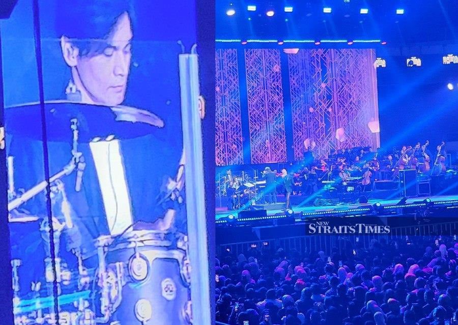 Female fans screamed whenever Dewa 19 drummer Tyo Nugros’ face was featured on the jumbo screens during the Indonesian rock band’s concert at Axiata Arena in KL last night. – Pic by Aref Omar