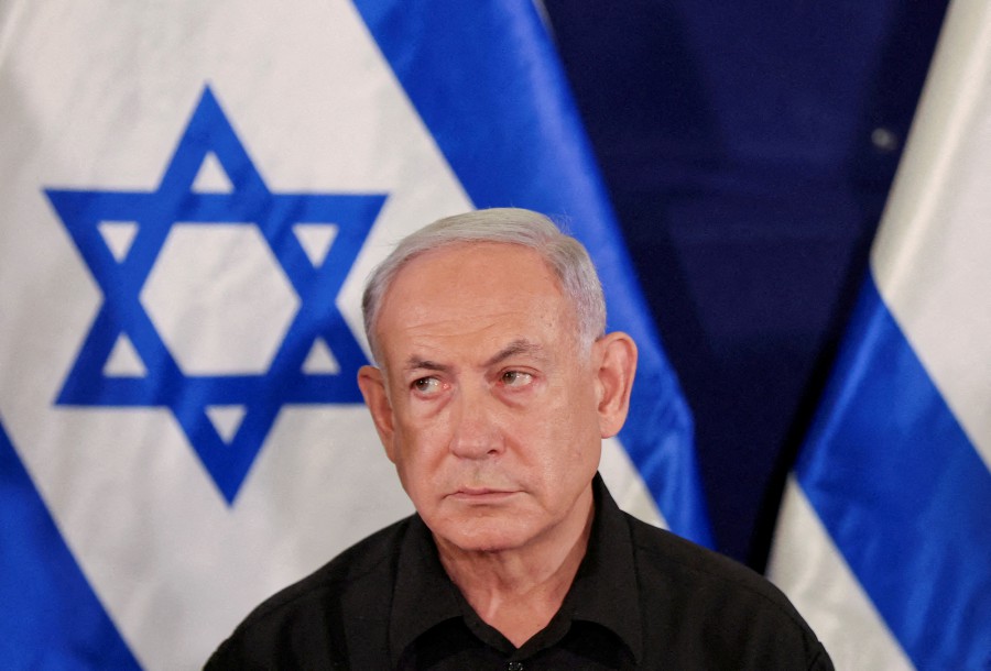 FILE PHOTO: Israeli prime minister Benjamin Netanyahu during a press conference with defense minister Yoav Gallant and Cabinet minister Benny Gantz in the Kirya military base in Tel Aviv , Israel , 28 October 2023. - REUTERS Pic